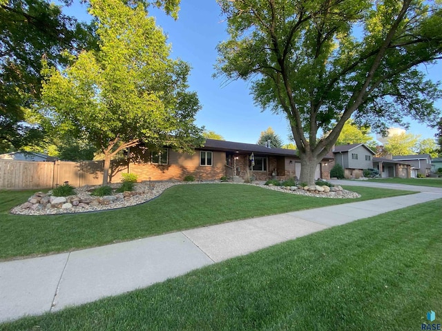 4604 S Woodwind Ln, Sioux Falls, SD 57103 - ranch-style house with stone siding