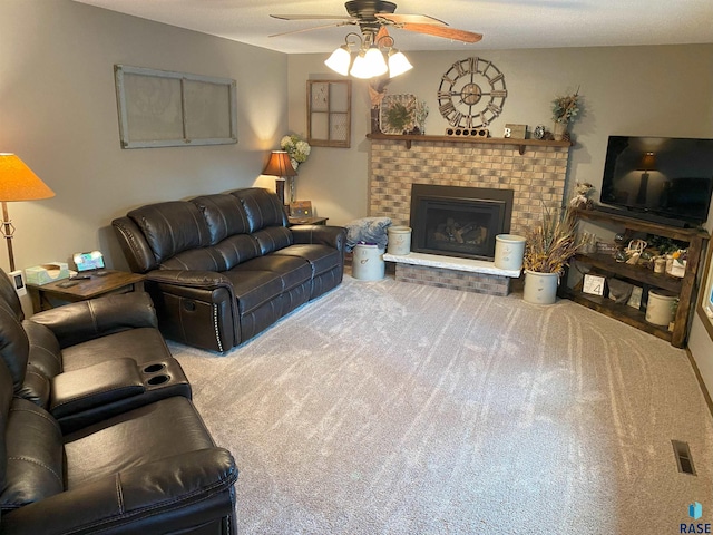 4604 S Woodwind Ln, Sioux Falls, SD 57103 - carpeted living area with a ceiling fan and a fireplace