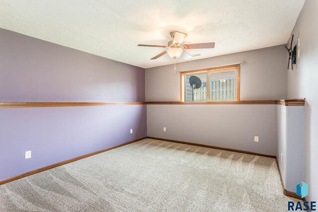5205 S Culbert Ave, Sioux Falls, SD 57106 - carpeted spare room with ceiling fan, baseboards, and a textured ceiling