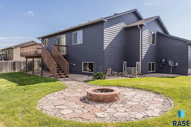 5205 S Culbert Ave, Sioux Falls, SD 57106 - rear view of house featuring an outdoor fire pit, stairs, a wooden deck, and a patio area