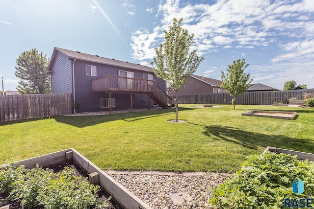 5205 S Culbert Ave, Sioux Falls, SD 57106 - view of yard featuring stairway, a garden, and a deck