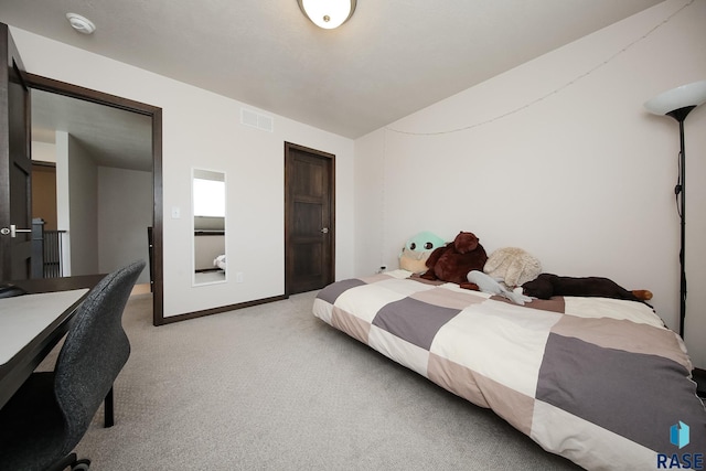 2407 E Copalis Pl, Sioux Falls, SD 57108 - bedroom featuring lofted ceiling, light carpet, and baseboards