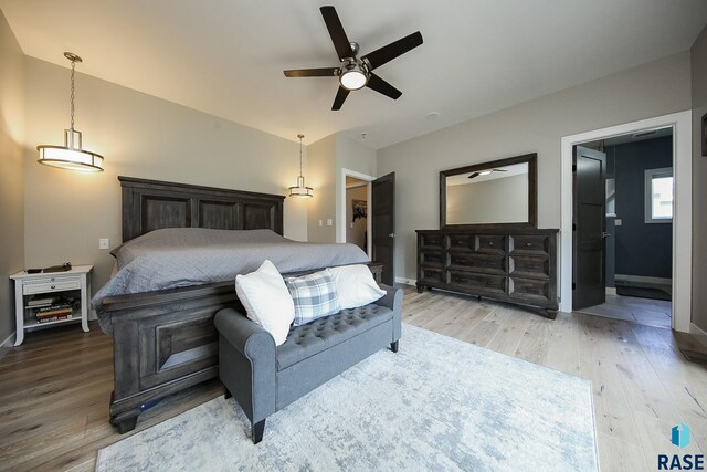 8609 E Fiddlewood Dr, Sioux Falls, SD 57110 - bedroom with light wood-style flooring and ensuite bath