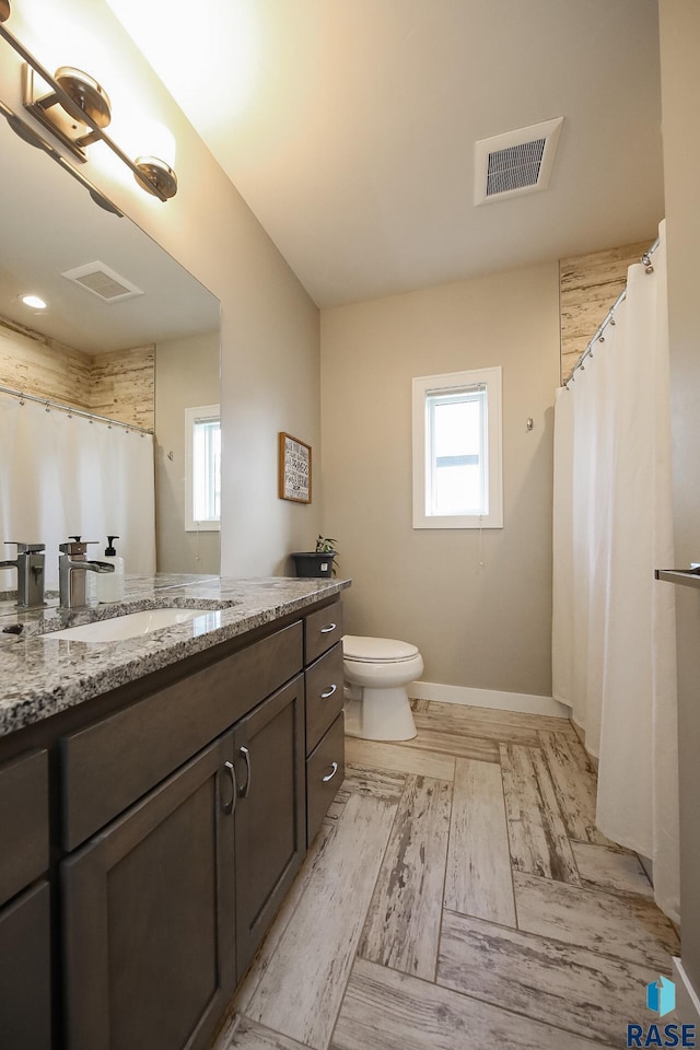 8609 E Fiddlewood Dr, Sioux Falls, SD 57110 - bathroom featuring vanity, healthy amount of natural light, and a shower with shower curtain