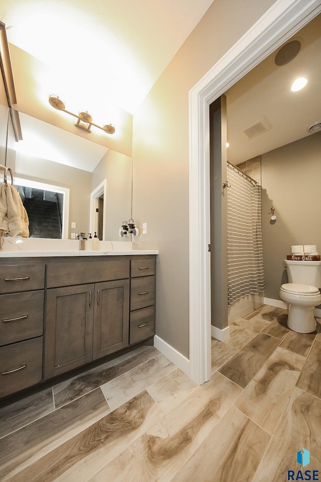 8609 E Fiddlewood Dr, Sioux Falls, SD 57110 - full bath with vanity and wood finished floors