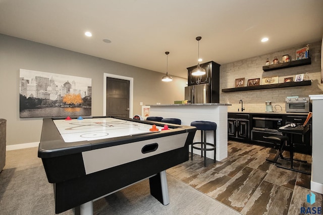 8609 E Fiddlewood Dr, Sioux Falls, SD 57110 - playroom featuring recessed lighting, bar with sink, and dark wood finished floors