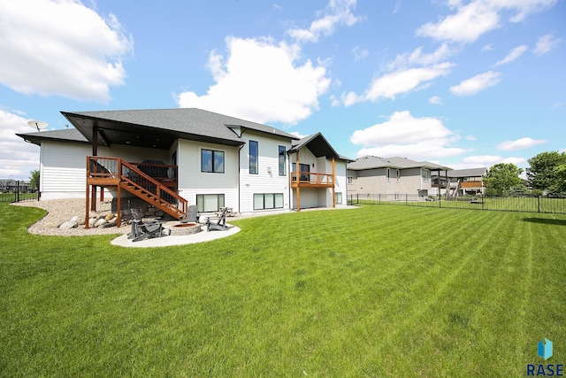 8609 E Fiddlewood Dr, Sioux Falls, SD 57110 - back of property with an outdoor fire pit, stairway, a deck, and roof with shingles