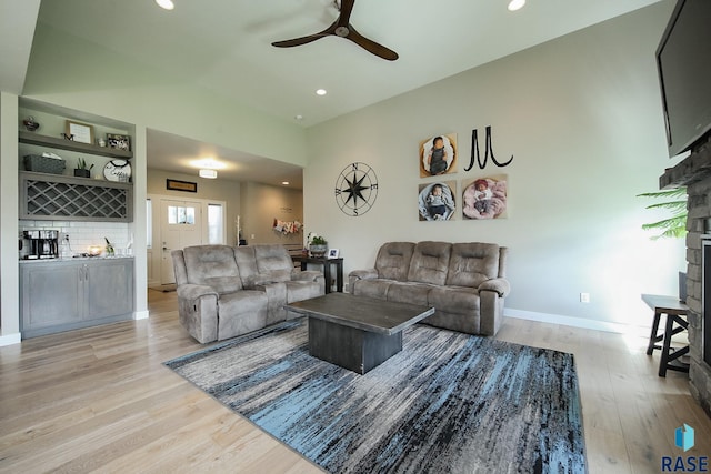 8609 E Fiddlewood Dr, Sioux Falls, SD 57110 - living area featuring light wood finished floors, a ceiling fan, recessed lighting, and a fireplace