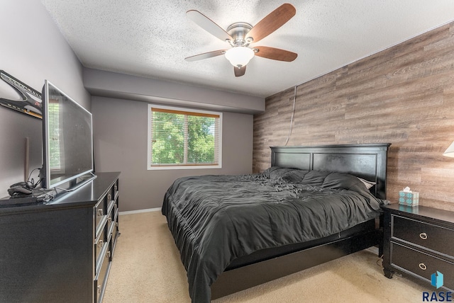 7104 W 68th St, Sioux Falls, SD 57106 - bedroom with light colored carpet, wooden walls, a textured ceiling, and ceiling fan