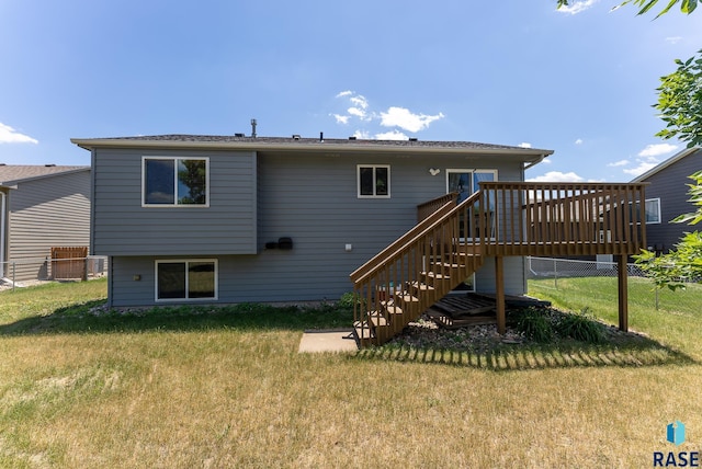 7104 W 68th St, Sioux Falls, SD 57106 - rear view of property with stairway and a deck