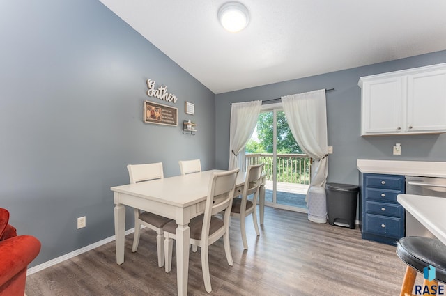 7104 W 68th St, Sioux Falls, SD 57106 - dining area with light wood finished floors, vaulted ceiling, and baseboards