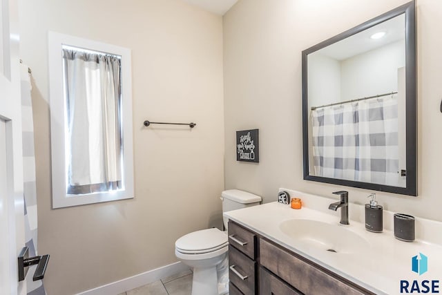 804 Johnson Creek Ct, Harrisburg, SD 57032 - full bathroom featuring toilet, vanity, tile patterned floors, and baseboards