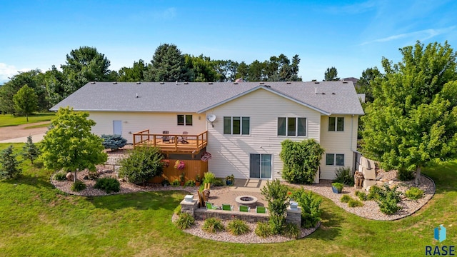 46493 258th St, Hartford, SD 57033 - back of property featuring an outdoor fire pit, a deck, a yard, and a patio area