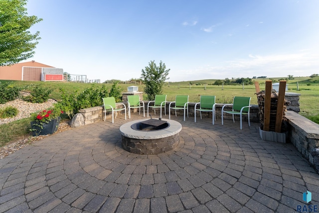 46493 258th St, Hartford, SD 57033 - view of patio with an outdoor fire pit and an outdoor structure