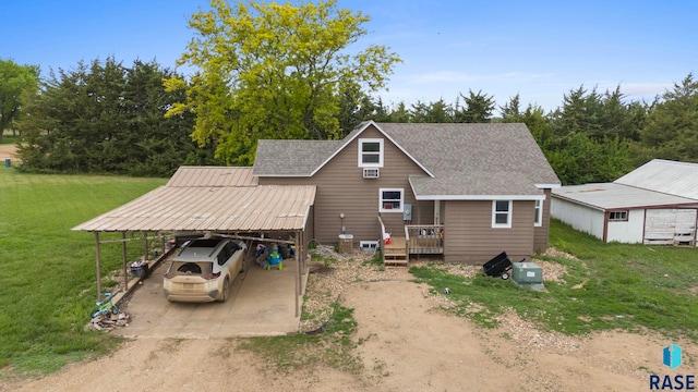 44904 289th St, Viborg, SD 57070 - rear view of property with dirt driveway, roof with shingles, a yard, and a carport