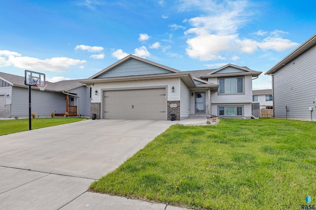 9509 W Liam St, Sioux Falls, SD 57106 - view of front of house with a garage, a front yard, driveway, and brick siding