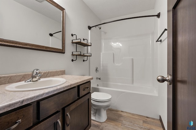 9509 W Liam St, Sioux Falls, SD 57106 - bathroom featuring vanity, wood finished floors,  shower combination, and toilet