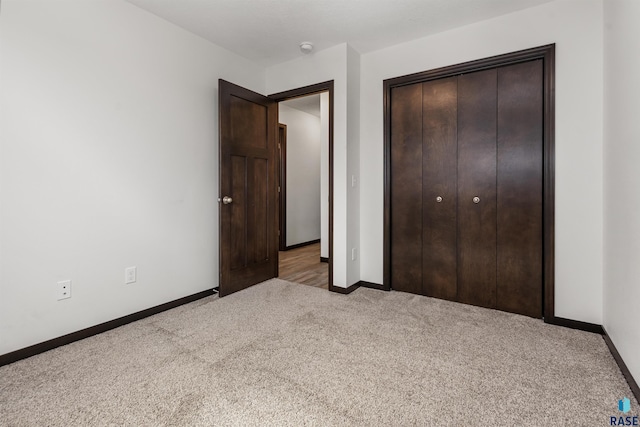 9509 W Liam St, Sioux Falls, SD 57106 - unfurnished bedroom with carpet floors, baseboards, and a closet