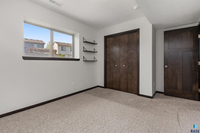 9509 W Liam St, Sioux Falls, SD 57106 - unfurnished bedroom with carpet flooring, baseboards, and a closet