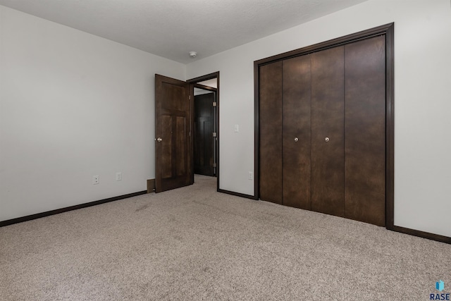 9509 W Liam St, Sioux Falls, SD 57106 - unfurnished bedroom featuring light colored carpet, a closet, and baseboards
