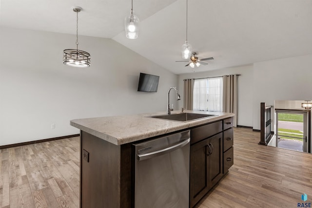 9509 W Liam St, Sioux Falls, SD 57106 - kitchen with stainless steel dishwasher, a sink, vaulted ceiling, dark brown cabinetry, and light wood-style flooring