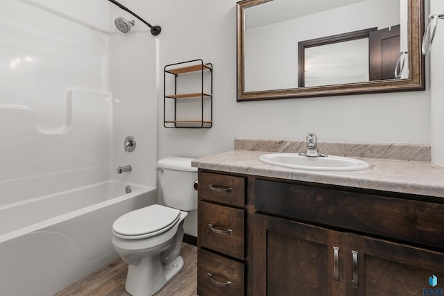 9509 W Liam St, Sioux Falls, SD 57106 - bathroom featuring wood finished floors, toilet, vanity, and shower / tub combination