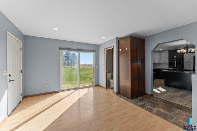 25280 480th Ave, Garretson, SD 57030 - kitchen featuring a chandelier, wood finished floors, baseboards, recessed lighting, and tasteful backsplash