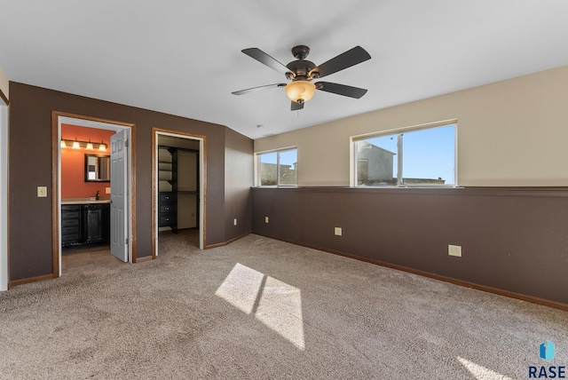 25280 480th Ave, Garretson, SD 57030 - unfurnished bedroom with carpet, a spacious closet, and baseboards