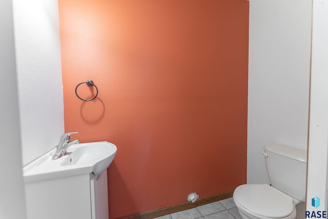 25280 480th Ave, Garretson, SD 57030 - bathroom featuring vanity, toilet, and tile patterned flooring