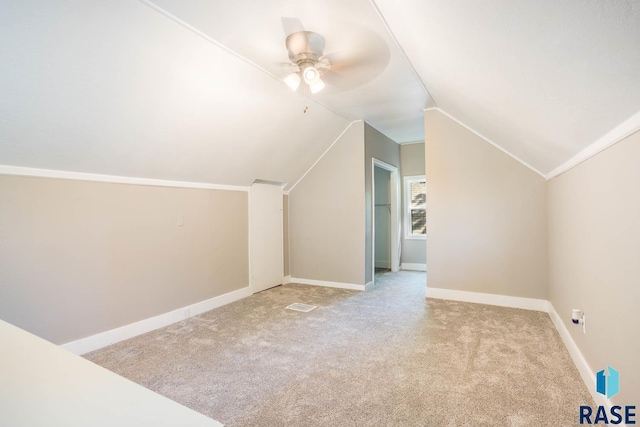 1205 W 14th St, Sioux Falls, SD 57104 - bonus room with vaulted ceiling, carpet, a ceiling fan, and baseboards
