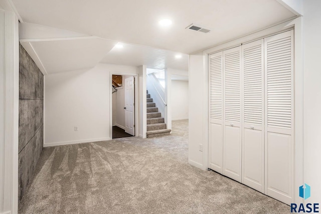 1205 W 14th St, Sioux Falls, SD 57104 - below grade area with carpet floors, stairs, baseboards, and recessed lighting