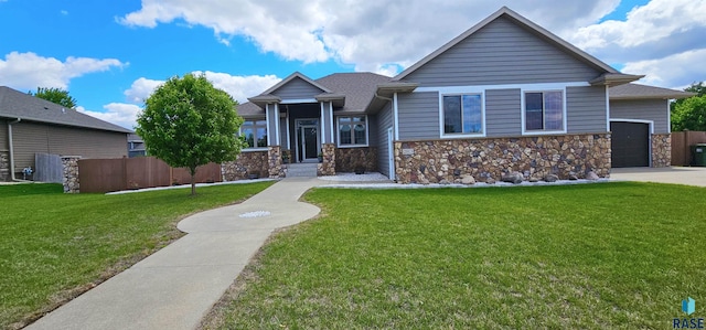 2813 W Stratton Cir, Sioux Falls, SD 57108 - view of front of property with a garage, stone siding, and driveway