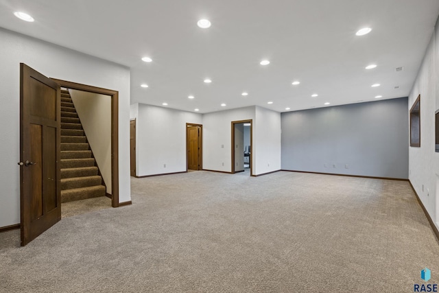 2813 W Stratton Cir, Sioux Falls, SD 57108 - below grade area with stairway, baseboards, light carpet, and recessed lighting