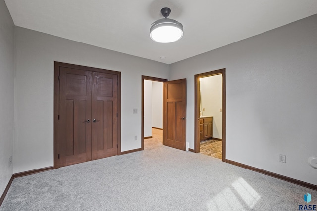 2813 W Stratton Cir, Sioux Falls, SD 57108 - unfurnished bedroom featuring light carpet, baseboards, a closet, and ensuite bathroom