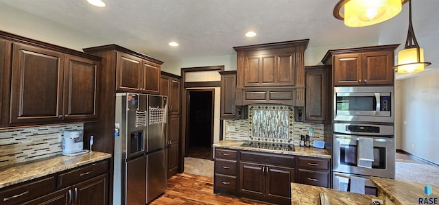 2813 W Stratton Cir, Sioux Falls, SD 57108 - kitchen featuring stainless steel appliances, backsplash, dark brown cabinetry, recessed lighting, and dark wood-type flooring