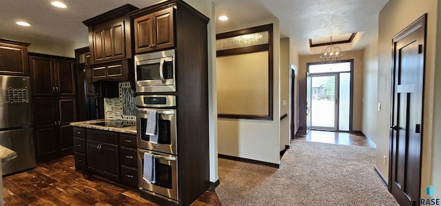 2813 W Stratton Cir, Sioux Falls, SD 57108 - kitchen featuring appliances with stainless steel finishes, recessed lighting, light stone counters, dark brown cabinets, and baseboards