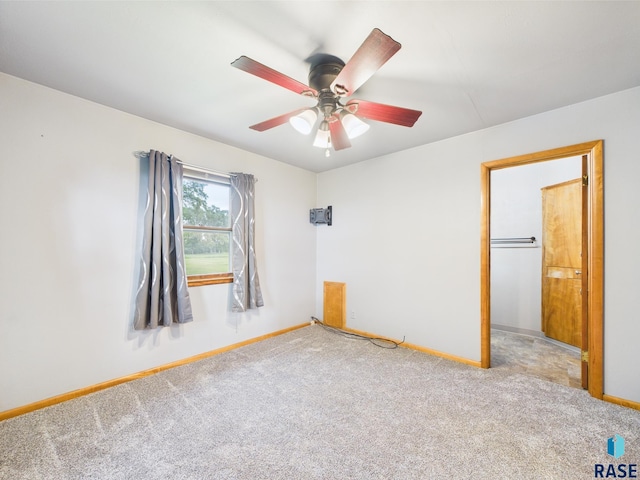 45390 284th St, Hurley, SD 57036 - unfurnished bedroom featuring baseboards, carpet, and a ceiling fan