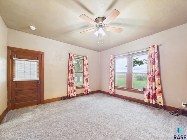 45390 284th St, Hurley, SD 57036 - unfurnished room featuring carpet flooring, baseboards, a ceiling fan, and a smoke detector
