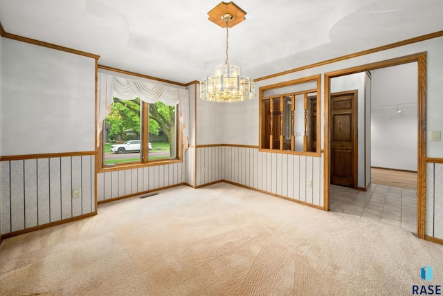 4704 S Pasque Cir, Sioux Falls, SD 57105 - carpeted empty room featuring crown molding, a chandelier, and baseboards