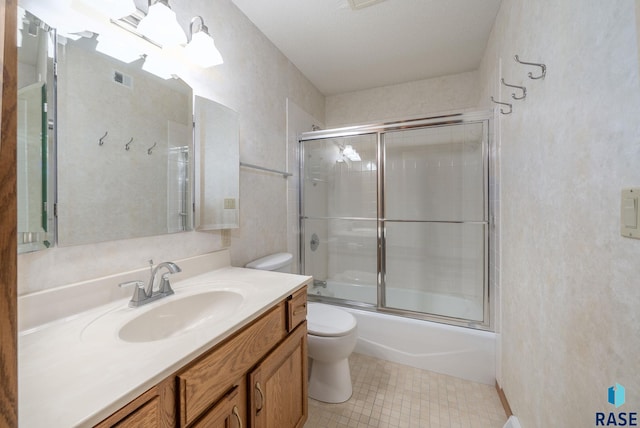 4704 S Pasque Cir, Sioux Falls, SD 57105 - full bath featuring toilet, vanity, and shower / bath combination with glass door