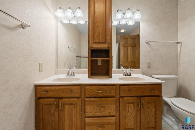 4704 S Pasque Cir, Sioux Falls, SD 57105 - full bath featuring double vanity, toilet, a shower, and a textured wall