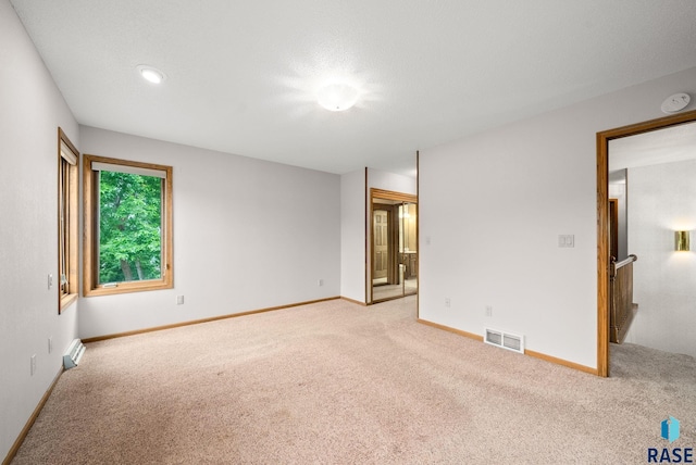 4704 S Pasque Cir, Sioux Falls, SD 57105 - spare room featuring light carpet, a smoke detector, and baseboards
