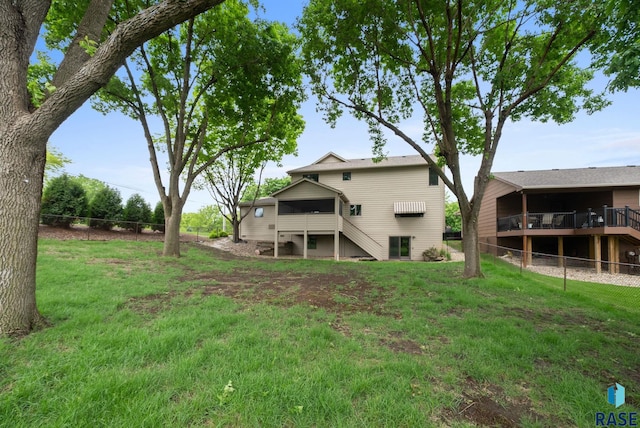 4704 S Pasque Cir, Sioux Falls, SD 57105 - rear view of property with stairway and a deck