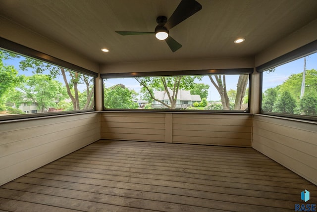 4704 S Pasque Cir, Sioux Falls, SD 57105 - unfurnished sunroom with ceiling fan, recessed lighting, hardwood / wood-style floors, and wooden walls