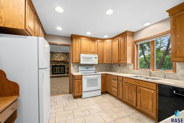 4704 S Pasque Cir, Sioux Falls, SD 57105 - kitchen with white appliances, a sink, light tile patterned floors, backsplash, and recessed lighting