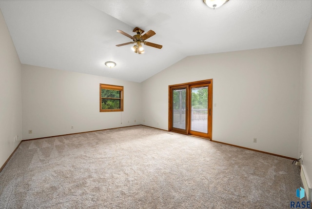 909 E 64th St, Sioux Falls, SD 57108 - unfurnished room featuring healthy amount of natural light, a ceiling fan, lofted ceiling, and carpet