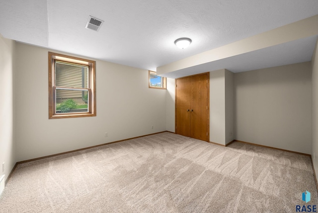 909 E 64th St, Sioux Falls, SD 57108 - basement with light colored carpet and baseboards