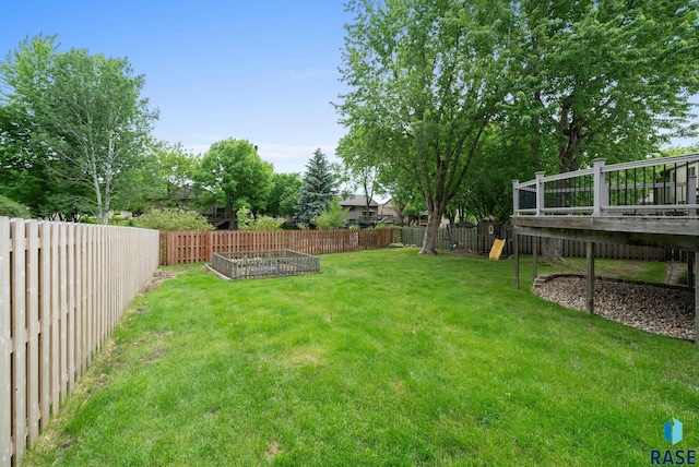 909 E 64th St, Sioux Falls, SD 57108 - view of yard with a vegetable garden, a playground, and a wooden deck