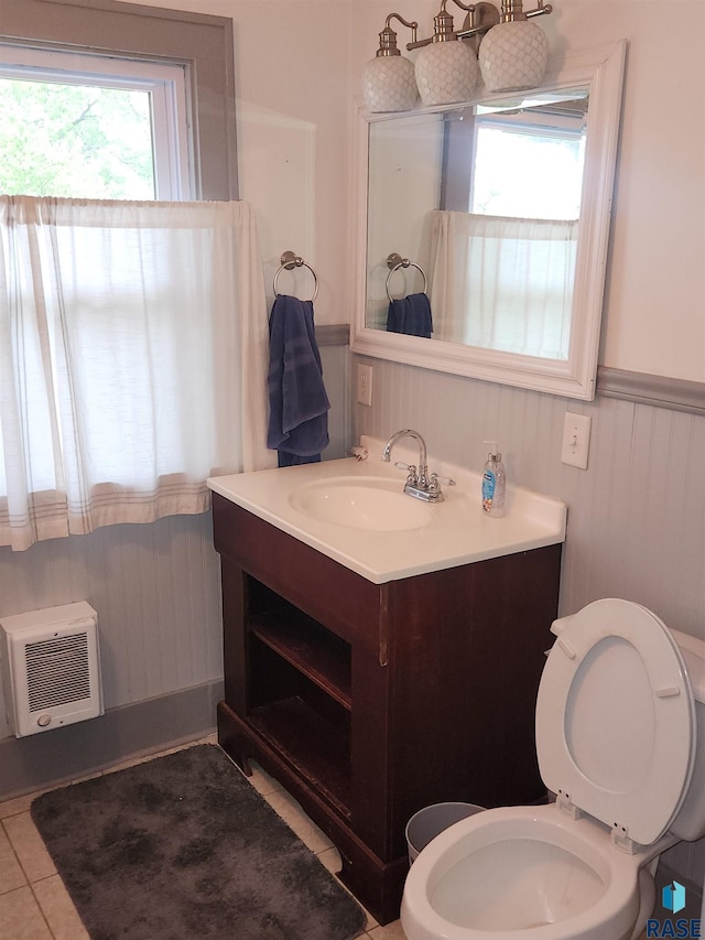 787 70th Ave, Beaver Creek, MN 56116 - bathroom featuring vanity, a wainscoted wall, toilet, a wall mounted AC, and tile patterned floors