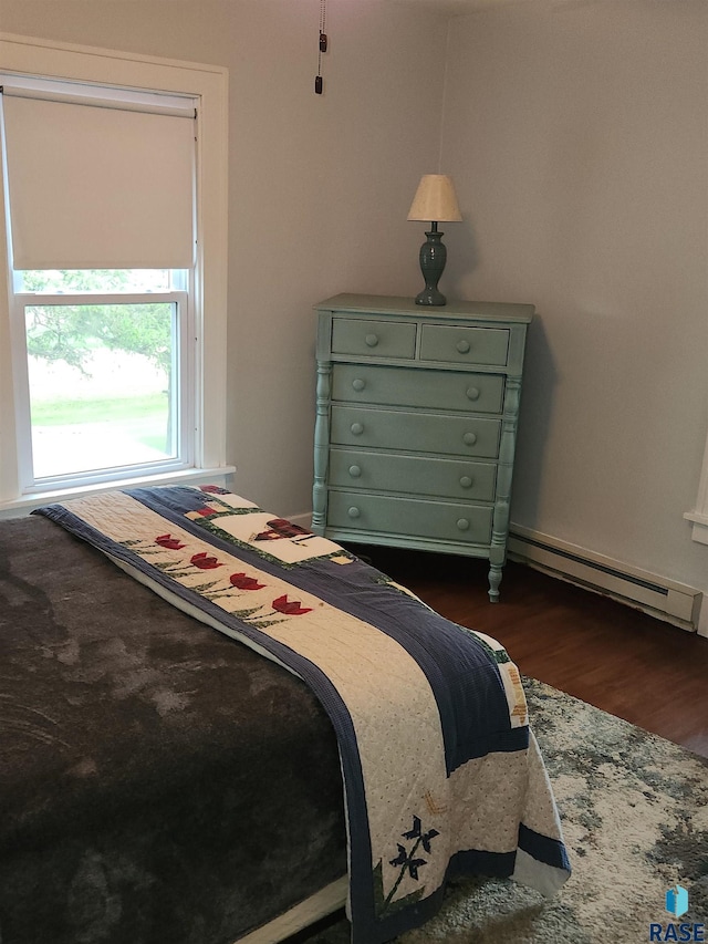 787 70th Ave, Beaver Creek, MN 56116 - bedroom with dark wood-type flooring and baseboard heating